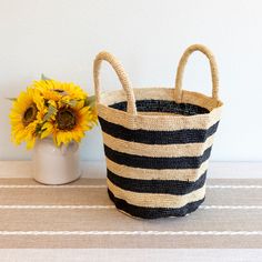 IN STOCK NOW SHIPPING FROM LOS ANGELES Add some summer vibes to your wardrobe with Elena Handbags' Raffia Basket Bag. Perfect for a day at the beach or a summer picnic, this bag features a stylish striped design and is made from durable and lightweight raffia material. Stay on trend and stand out with this must-have summer fashion accessory! Natural Soft Raffia Straw Handmade Size: 9"H x 14"W x 7"D Designer Style ID: 8652 Trendy Summer Picnic Bag, Chic Beach Tote Bag For Picnic, Trendy Summer Beach Bag For Picnic, Chic Summer Picnic Bag, Chic Summer Picnic Bags, Black Bucket Beach Bag For Beach Season, Beachy Bucket Bag For Travel, Eco-friendly Black Beach Bag For Summer, Large Capacity Bucket Bag For Picnic