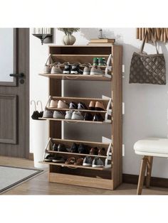 the shoe rack is made from wood and holds many pairs of shoes