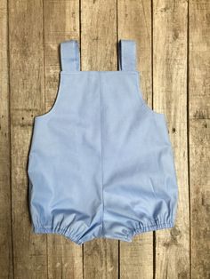 "- please include in the message to seller the date needed for. Shipping is 3-4 weeks from purchase. If no date is left it will be shipped by the schedule ship by date on the invoice. Please also include name if you would like it on the outfit. -This Light blue colored bubble romper or jon jon is made from a vintage pattern -made from 100% cotton light blue fabric -unisex- I think it would look cute on a boy or girl -free-hand stitch applique of a sunshine on front with number one ballon -has sn Boys First Birthday, Colored Bubbles, Light Blue Fabric, Jon Jon, Boy First Birthday, Bubble Romper, My Sunshine, You Are My Sunshine, Boys Clothing