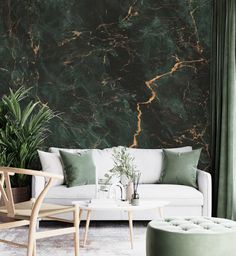 a living room with green marble wallpaper and white couches in front of it