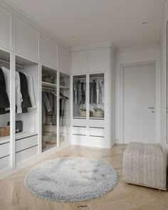 a bedroom with white closets and carpeted flooring on the wooden floor next to it