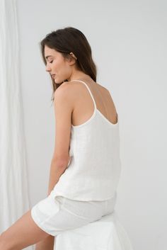 "When ordering you can choose to have the \"SHORTS\" or \"TOP\" only or the whole \"PAJAMA SET\" of both items. When buying a set you save 5 euro. Milky white ELLA shorts with two side pockets and relaxed fit TILDA cami top. TOP: - length is ± 59 cm (23.2\") (depends on size) - spaghetti strap - bust darts - v neckline BOTTOM: - outseam ± 38 cm (14.9\") (depends on size) - inseam is ± 10 cm (3.9\") - elastic waistband with fabric strap - two side pockets DETAILS: - 100 % European, pre-washed med Summer V-neck Camisole For Lounging, Summer Lounging Camisole, White Summer Sleepwear For Lounging, White Summer Lounging Sets, White Summer Lounging Sleepwear, Sleeveless Summer Lounging Sets, Summer Lounging Camisole Tops, Sleeveless Camisole For Summer Relaxation, Summer Sleeveless Camisole For Relaxation