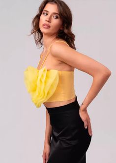 Inject a touch of timeless sophistication into your wardrobe with this delightful Organza Flower Detail Crop Top. Delicate spaghetti straps and a vibrant yellow hue combine with captivating organza flower detail to create an exquisite, show-stopping piece. Perfect for elevating any outfit. Fabric: polyester fiber Yellow Organza Blouse Piece For Festivals, Luxury Yellow Organza Choli, Elegant Ruffled Organza Tops, Luxury Floral Embroidered Organza Tops, Luxury Organza Ruffle Top, Elegant Evening Dresses Long, White Lace Dress Short, White Lace Shorts, Clubwear For Women