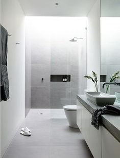 an image of a white bathroom with black accents