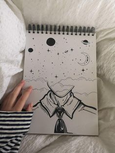 a drawing of a man's shirt and tie on a paper with space in the background