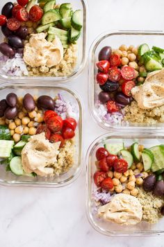 four plastic containers filled with different types of food