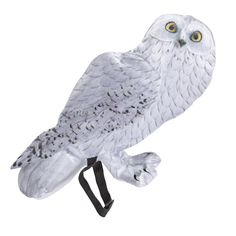 an owl figurine sitting on top of a stand