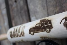 a close up of a baseball bat with animals on it's handlebars