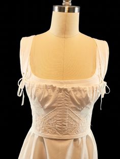 Beautifully and delicate looking short stay, corded with sturdy cotton cord. The front of this corset has 2 flat steel bones that rest between the gored bust panels. The bust is adjustable with a gathering cord. The straps are adjustable. Made with 100% cotton. This stay/corset gives the perfect support and silhouette for Regency gowns, as well as my Italian Renaissance style gowns. Time to make is set at 4-6 weeks, however if you need something sooner please feel free to message me. I can usual