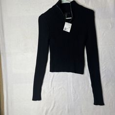 This Stylish Black Sweater From Forever 21 Is A Must-Have For Any Fashion-Savvy Woman. Made Of 100% Cotton And Featuring A Solid Pattern With A Ribbed High Neck And Long Sleeves, This Sweater Is Perfect For Any Occasion, Whether It's A Party, Cocktail Or Casual Event. It Also Comes With A 1/4 Zip For Added Convenience And Style. Additionally, This Sweater Is Easy To Care For With Hand Wash Only Instructions. The Size Is A Regular Fit, With A Size M, And The Sweater Is Available All Year Round Fo Black Cropped Sweater With Ribbed Collar, Black Ribbed High Neck Sweater, Black Ribbed V-neck Long Sleeve Sweater, Forever 21 Fitted Winter Sweater, Forever 21 Black Crew Neck T-shirt, Batwing Sleeve Sweater, Big Sleeves, Cable Knit Turtleneck Sweater, Ribbed Turtleneck Sweater