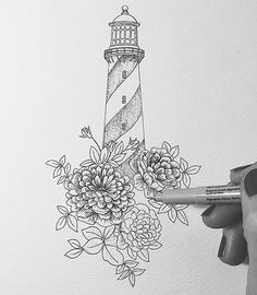 a drawing of a lighthouse with flowers on it