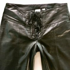 "Vintage 90's black leather motorcycle pants Tied closure Fixed polyester insulated lining Exterior is in excellent condition with minimal wear Interior is in great condition Labels are intact Name on label - Wilsons Leather Maxima Size on label - 10 Approximate Measurements: Waist 32\" Upper Thigh 23\" Inseam 34\" Rise 9\" All measurements are taken seam to seam while laying flat. Once the item is in your cart you may select the shipping method that works best for you. Here at This Vinyl Life, Lace Up Leather Pants, Leather Motorcycle Pants, Pants With Lace, 90s Pants, Sleeveless Turtleneck Top, Biker Pants, Motorcycle Pants, Lace Pants, Black Leather Pants