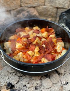 a pan filled with food sitting on top of a stone counter