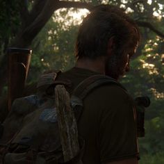 a man with a backpack walking through the woods at sunset in unrecognizable sunlight