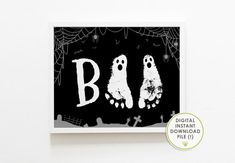 a black and white halloween card with three ghost feet on it's side, the letter b