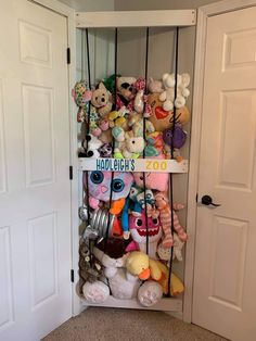 a shelf filled with lots of stuffed animals