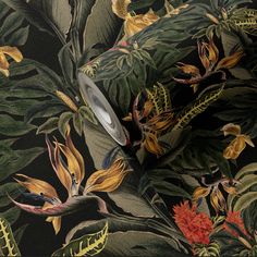 an image of a floral wallpaper with leaves and flowers on black background that looks like it has been painted