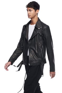 Our number one bestselling men's jacket of all time, Motorcycle Jacket by JONNY COTA is crafted from lightweight supple sheepskin, bringing all-season wearability to this updated classic biker jacket silhouette. Quilted moto-style details on shoulder and sleeve. Sculpted shoulder pads. Silver zipper, belt buckles, and snap details on body. Removable collar. 100% lambskin leather. Specialty leather clean SIZE + FIT Fitted in shoulder and sleeve. Draped open-body fit on torso. Slim fit; if between