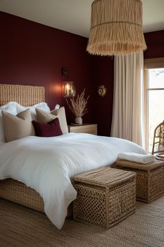 a bedroom with a large bed and wicker furniture