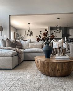 a living room filled with furniture and a large mirror