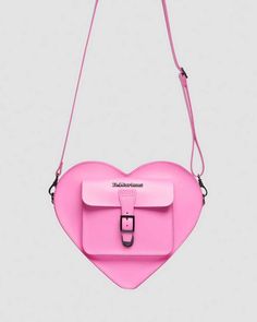 Find DR. MARTENS Heart Shaped Leather Backpack on Editorialist. The Dr. Martens heart-shaped backpack is crafted from Kiev leather, a hardwearing, rigid leather with a smooth surface and slight sheen. It features a front zip pocket, adjustable strap, and buckle closure. The backpack measures 11 1/2 inches tall, 10 inches wide, and 3 inches deep. It can be worn as a bag or backpack. The strap and front pocket are constructed from black and white patent leather. Leather Bags With Adjustable Strap For Valentine's Day, Leather Heart-shaped Bag With Adjustable Strap, Leather Satchel Bag For Valentine's Day, Heart-shaped Leather Shoulder Bag, Everyday Use Heart-shaped Leather Shoulder Bag, Heart-shaped Leather Shoulder Bag For Gift, Heart-shaped Leather Shoulder Bag Gift, Leather Heart-shaped Bag With Detachable Strap, Heart-shaped Leather Bags For Gifts