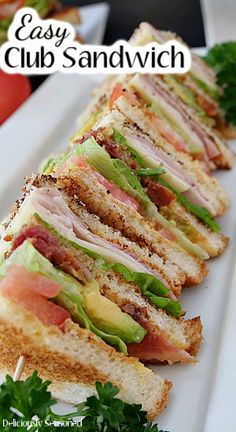 the sandwich is cut in half and ready to be served on the plate with parsley