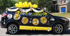 a car decorated with balloons and streamers