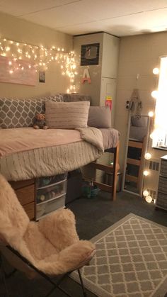 a dorm room with lights strung above the bed