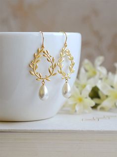 Hey, I found this really awesome Etsy listing at https://www.etsy.com/listing/225194051/ivory-cream-pearl-earrings-gold-bridal Jewelry Flat Lay Ideas, Wreath Chandelier, Pearl Dangle Earrings Wedding, Gold Laurel Wreath, Ivory Jewelry, Wreath Earrings, Teardrop Pearl Earrings, Wedding Earrings Chandelier, Bridal Jewellery Earrings