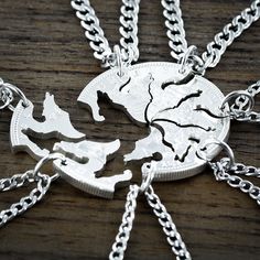 "This wolf design is hand cut from a coin into the shape of 7 wolves. It makes a gift for the \"Wolf Pack\", family or friends that stick together through thick and thin. It is cut by hand from a real Silver Dollar." Best Friends Necklaces, Wolf Ring, Wolf Design, Family Necklace, Couple Jewelry, Friend Necklaces, Wolf Pack, Bff Gifts, Custom Initials