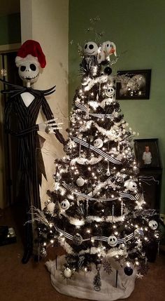 a decorated christmas tree in the shape of a skeleton and jack skellingy doll