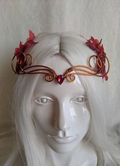 A beautiful, intricate crown with a burgundy crystal decorating the center of the copper wire and autumn leaves surrounding the piece. Eyes will follow the delicate swirls and breezy leaves as the garland decorates your head, perfect for renaissance fairs, weddings, cosplay, or any event of your choosing! Choose between a Burgundy or Red Crystal! Fae Characters, Red Crowns, Autumn Crown, Fantasy Crowns, Copper Autumn, Copper Crown, Elven Tiara, Woodland Crown, Wire Crown