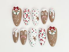 🌟 Holiday Cheer Press-On Nails: Gingerbread Dreams Collection 🎄🍬 ✨ Step into the holiday spirit with our Gingerbread Dreams Press-On Nails, a festive masterpiece perfect for spreading cheer and style this Christmas season. Each nail is lovingly handcrafted with intricate details, blending traditional holiday motifs with modern elegance. 🏠🍭 🌟 Key Features & Highlights 🌟 🏠 Gingerbread House Design: Featuring adorable gingerbread houses, candy canes, and festive wreaths that bring Christmas magic to your fingertips. 🎄 Festive Holiday Palette: Classic holiday hues of red, green, and white, paired with charming polka dots and delicate bows for a whimsical touch. 🍬 Hand-Painted Details: Each nail is a mini work of art, meticulously painted for a unique and high-quality finish. ⏱️ Quick Christmas Nails With Gingerbread, Disney Gingerbread Nails, Gingerbread House Nail Art, Gingerbread Cookie Nails, Gingerbread Nail Designs, Gingerbread House Nails, Wreath Nail Art, Gingerbread Nail Art, Unique Christmas Nails