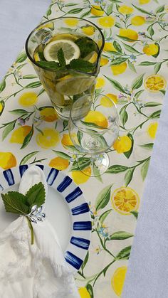 a table topped with plates and glasses filled with lemonade