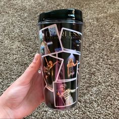 a person holding up a travel mug with photos on it and the words i love you