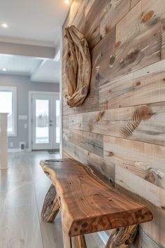 a wooden bench sitting in front of a wall with wood planks on the side