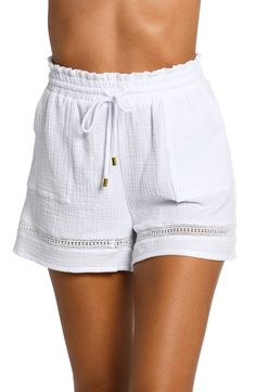 Relax after a swim in these gauzy cotton cover-up shorts featuring ladder-stitch details for breezy appeal. 3" inseam; 26" leg opening; 12" front rise; 17" back rise (size Medium) Elastic/drawstring waist Front scoop pockets 100% cotton Hand wash, line dry Imported