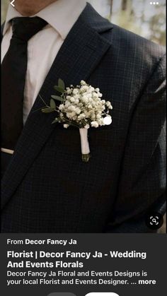 a man in a suit and tie wearing a boutonniere with flowers on it