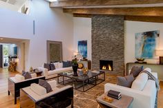 Luxury Beverly Hills ranch home living room interior design with chic & rustic, elegant, modern artistic elements. Luxury California, Indoor Outdoor Fireplaces