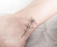 a small flower tattoo on the ankle is one of the most popular tattoos for women