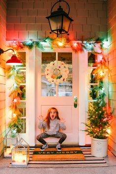 Colorful Farmhouse Christmas Porch - Modern Glam Christmas Decor Ideas Outdoor Colored Lights, Outdoor Colored Christmas Lights, Outdoor Christmas Lights Colored, Vintage Christmas Lights On House, Mixing White And Colored Christmas Lights Outside, Colored Lights Outdoor Christmas, Front Porch Christmas Decor Colored Lights, Cottage Christmas Lights, Christmas Light Porch Ideas