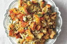 a white plate topped with stuffing on top of a table