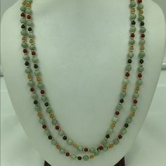 Here We Have A Head Turning Beautiful Color Patterned Jade & Gold Beads Necklace. The Gold Beads Are Tested 14k Gold. This Necklace Can Be Worn In Multiple Ways (See Pics 1, 2 & 4). This Piece Can Be A Great Addition To Your Wardrobe. Size: 45” Long Weight: 43.4g 82 Light Green Jades @ 6.09mm Round Each 27 Dark Green Jades @ 4.22mm Round Each 28 Red Agate Beads @ 4.22mm Round Each 28 Yellow Jade Beads @ 4.22mm Round Each 166 Gold Beads @ 1.92mm Height X 2.55mm Width Gold Beads Necklace, Yellow Jade, Gold Bead Necklace, Jade Necklace, Red Agate, Jade Beads, Agate Beads, Beads Necklace, Jade Green