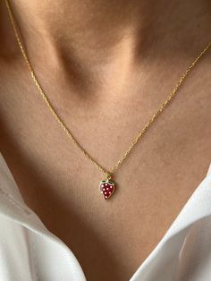 Yummy red strawberry necklace  NEW! Make it custom 🔠 We can engrave an initial or a name to the behind of strawberry pendant Get this beautiful minimalist jewelry made with the quality of perfect elements✨ You can choose 925K Sterling Silver with the options of Gold, Rose Gold or White Gold colors. High quality jewelry for everyone 🤍  Details * 925K Sterling Silver Option → 14K Gold, Rose Gold or White Gold plated * Chain length is approximately 18 inches (16+2 in extender) / 45 cm (40+5 cm extender) * Time is everything! You will receive your package as soon as possible 🚚  * We care about the quality of metal to make sure it will last for a long time * We use enamel technique to color the jewelry and high quality zircons only * There can be tiny differences on each item. Length differe Berry Colored Fruit Design Jewelry Gift, Cute Fruit Design Jewelry As Gift, Cute Fruit Design Jewelry For Gifts, Red Initial Pendant Jewelry As A Gift, Red Initial Pendant Jewelry For Gift, Red Initial Pendant Jewelry Gift, Berry Necklace, Strawberry Jewelry, Christmas Watches