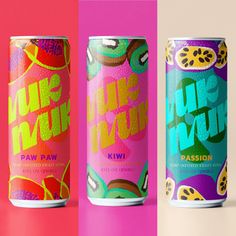 three cans of juice with different designs on them