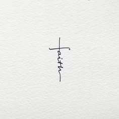 the word faith written in cursive ink on white paper with a black marker