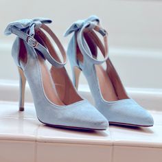 Light Blue Suede Heels With Back Ankle Bow And Strap. 4” Heel. Size 5. New. Never Worn. Light Blue Suede Heels, Chic Light Blue Heels For Party, Chic Light Blue Party Heels, Chic Light Blue Heels, Chic Light Blue Heels For Formal Occasions, Elegant Light Blue Heels With Wrapped Heel, Chic Light Blue Formal Heels, Blue And White Heels, Sky Blue Heels