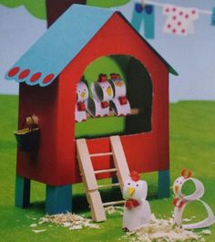 an image of a toy chicken house with chickens in it and a ladder leading up to the door