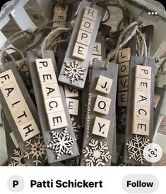 wooden scrabbles with words that spell out peace and snowflakes