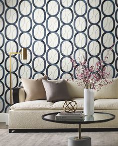 a living room scene with focus on the sofa and wallpapers that have circles